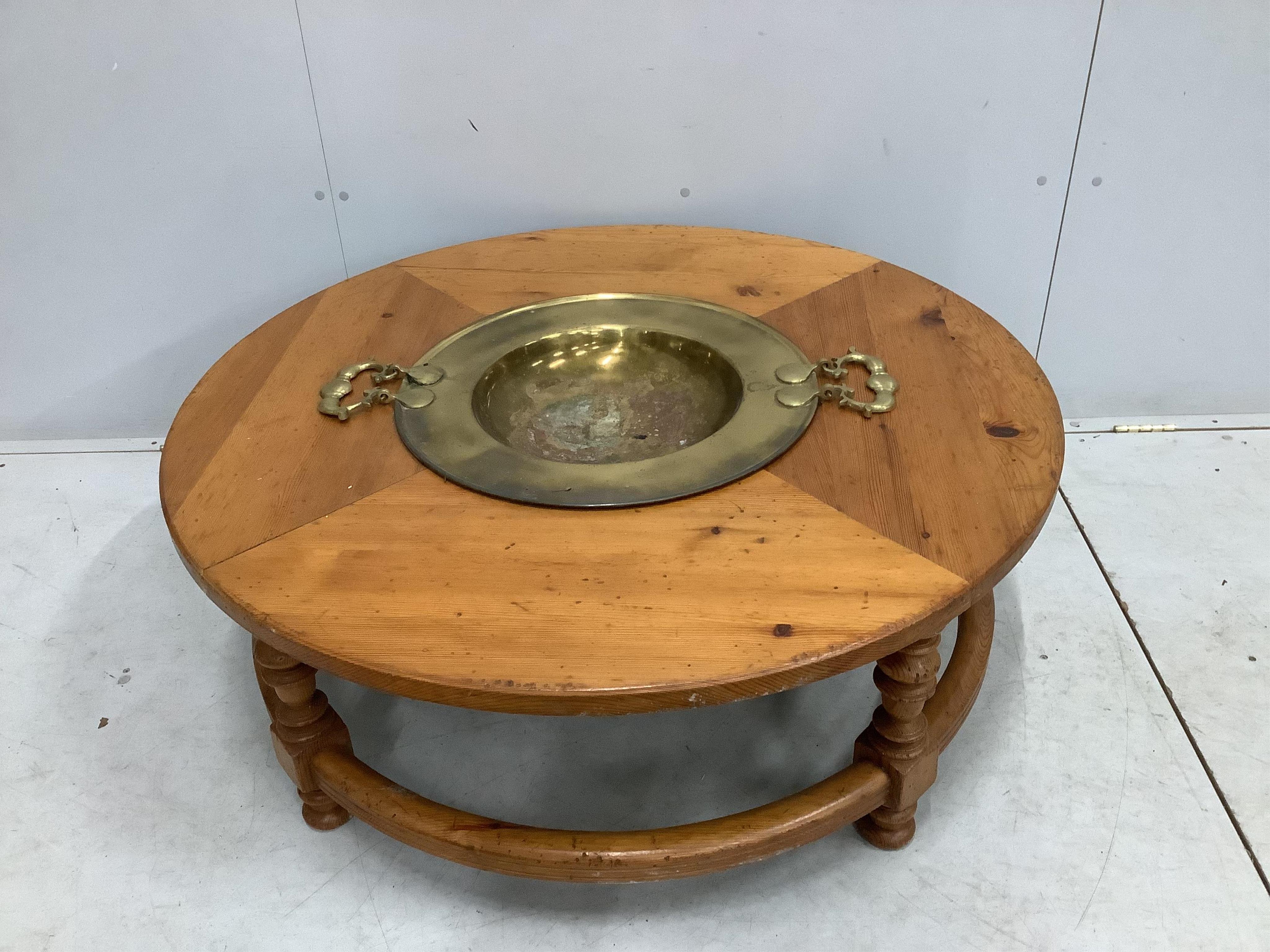 A Brazier Brassro circular pine coffee / cocktail table, diameter 110cm, height 42cm. Condition - fair